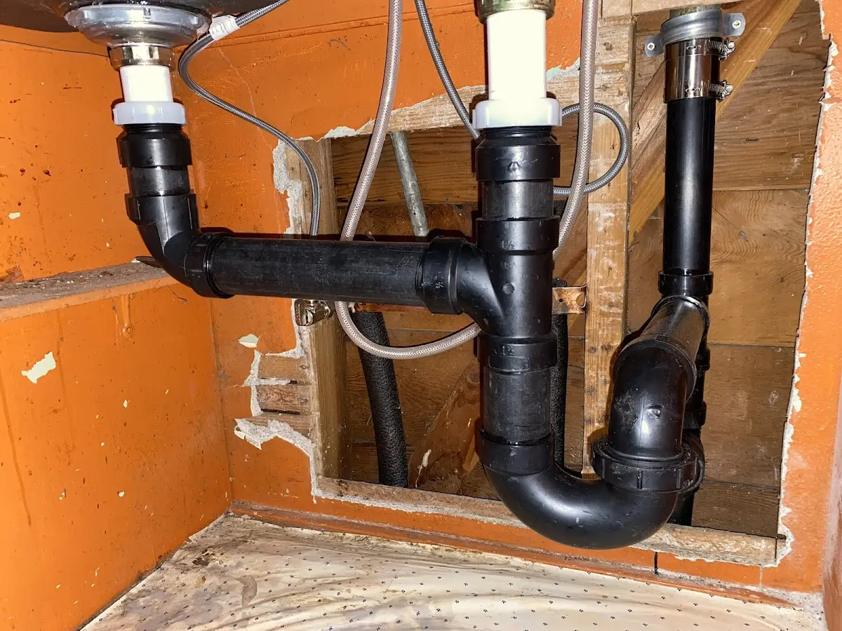 Professional Garbage Disposal Repair equipment and tools on the job in Clay